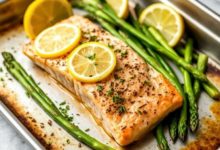 One-pan lemon garlic salmon with asparagus on a tray